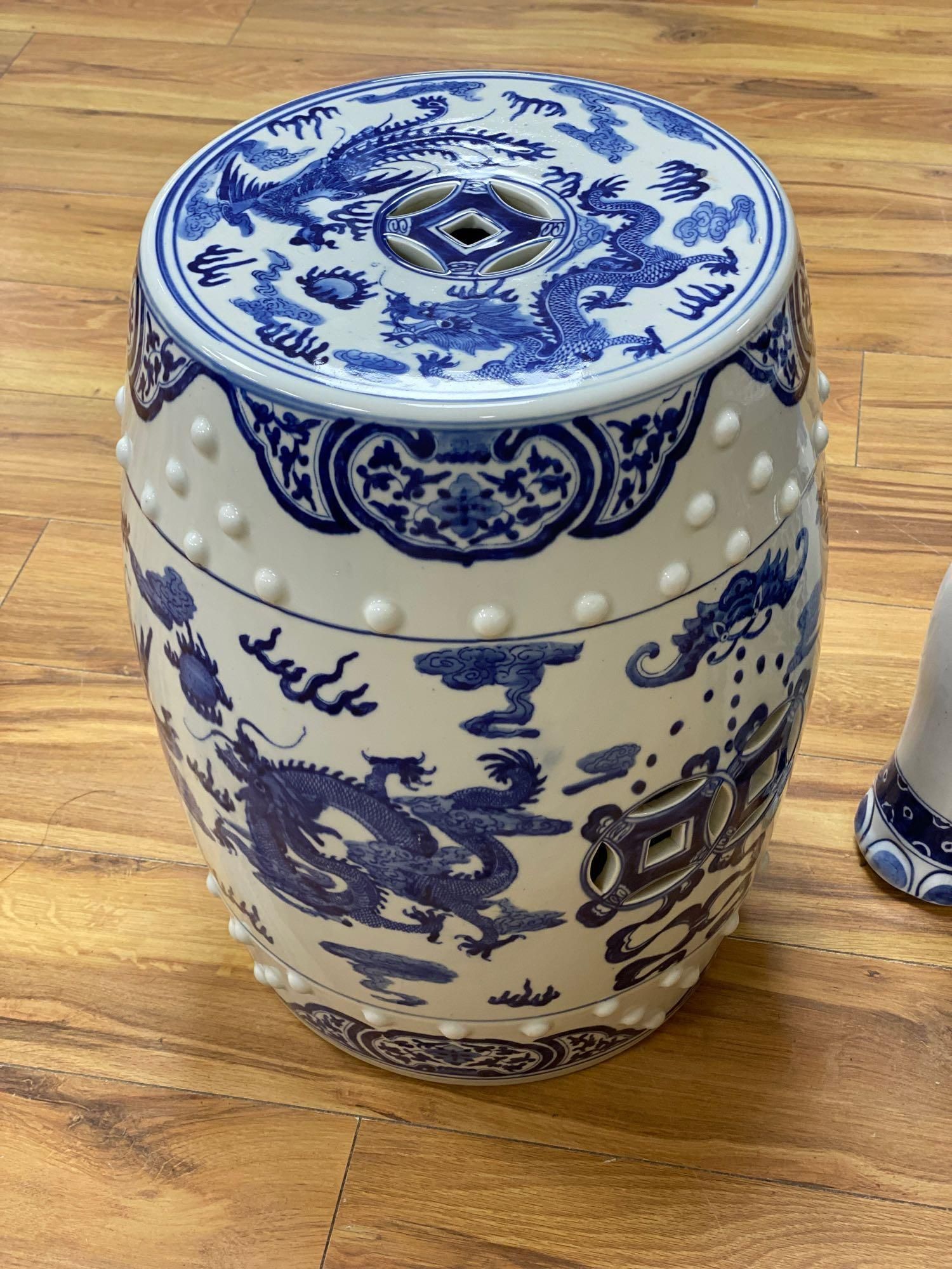 A Chinese blue and white ceramic garden seat and a similar elephant seat, 47.5cm tall